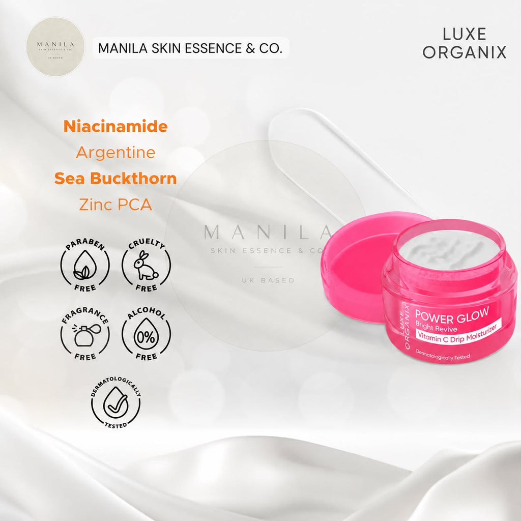 A jar of Manila Skin Essence & Co. Power Glow Niacinamide Serum with Zinc PCA, shown with its lid off to reveal white serum inside, set against a draped white satin background with product details and certification icons.